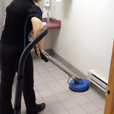 Revolution™ tile cleaning tool in use